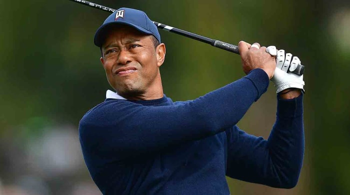 Tiger Woods tees off during the 2023 Genesis Invitational golf tournament.